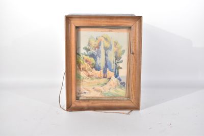 une image représentant un tableau dans un cadre en bois posé sur une surface blanche