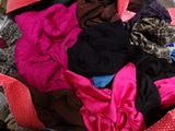 a pile of clothes that is sitting on the floor