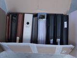 a cardboard box filled with lots of different types of luggage