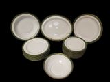 many plates that are sitting on a black table