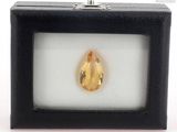 an image of a yellow diamond in a black box on a white surface