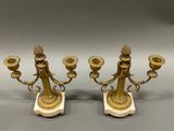 pair of antique brass candlesticks on marble bases