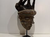an image of a sculpture of a head with a crown on top of it