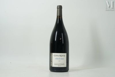 a bottle of wine that is sitting on a table