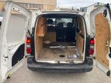 a white van with its doors open in a parking lot
