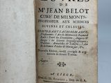 an old book with writing on it sitting on a table