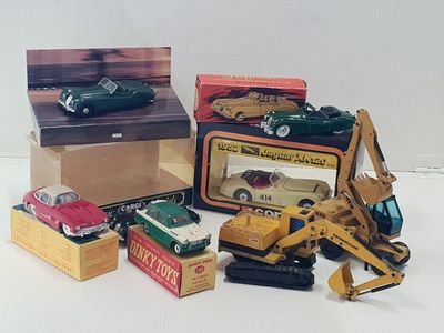 a lot of toy cars that are sitting on a table
