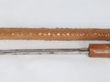 two tools that are sitting on a white surface