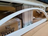 a box that is sitting under a window in a room