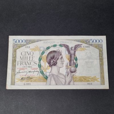 a picture of a bank note with a woman holding a bird