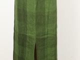 a green skirt with fringes on a mannequin mannequin