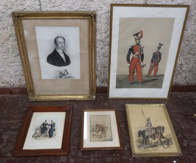 three framed pictures of men in uniforms and hats on a table