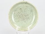 green plate with a white base on a stand on a white background