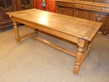 a wooden table that is sitting in the middle of a room