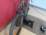 a bike that is parked against a wall in a room