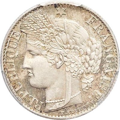 gros plan d'une pièce de monnaie sur laquelle figure une tête de femme