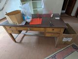 a desk with a drawer and a box on top of it