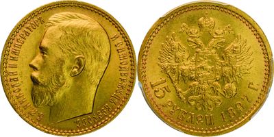 a close up of a gold coin with a man ' s face on it