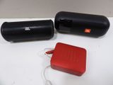two speakers that are sitting next to each other