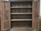 an image of a large wooden bookcase with open doors