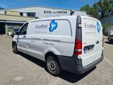 the van is parked in the parking lot outside of the building