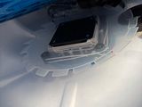 a close up of a cell phone in a plastic container