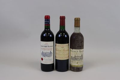 three bottles of wine are sitting next to each other on a white surface