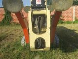 a parking meter in the middle of a grassy field