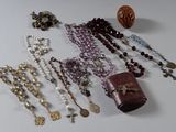 a lot of beads and a book laying on a table