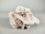 a piece of cloth that looks like a flower on a table