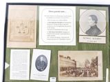 a picture of a display of old photographs and other items