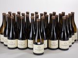 bottles of wine are lined up in a row on a table
