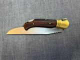 a knife with a wooden handle on a table