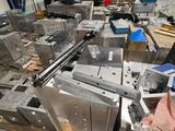 a lot of machines that are sitting in a warehouse