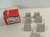a box of small pieces of paper on a table