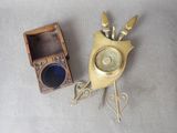 a clock and a box on the floor next to each other