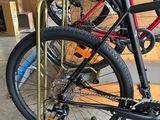 two bikes that are sitting on a stand in the garage