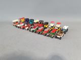 a lot of toy trucks that are lined up together