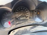 a close up of a car dashboard with a speedometer