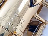 a close up of a saxophone that is on a table