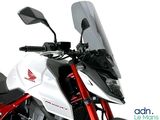 a white and red motorcycle parked on the side of the road