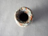 a small vase that is sitting on a table