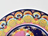 a colorful plate with a picture of a cat on it