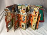 a folded book with a picture of a building inside of it