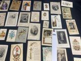 a lot of old postcards on a black table