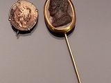 three different types of gold and silver items on a gray surface