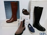 three pairs of women ' s boots and a box of shoes