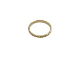 a close up of a gold ring on a white background