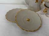two plates and a tea pot on a table