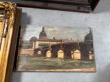 a picture of a painting on the wall next to a picture of a bridge